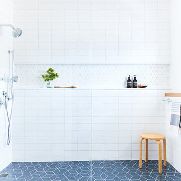 Shower with White and Blue Bathroom Tiles