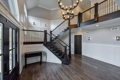 Inspiration for a timeless wooden u-shaped wood railing staircase remodel in Chicago with painted risers