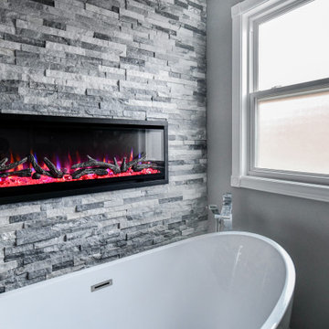 Striking Master Ensuite Featuring a Built-In Electric Fireplace