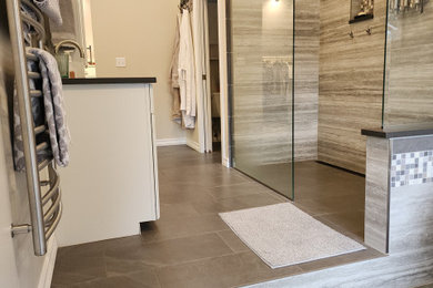 Large 1950s master porcelain tile double-sink bathroom photo in Seattle with shaker cabinets, white cabinets, a two-piece toilet, solid surface countertops and a built-in vanity