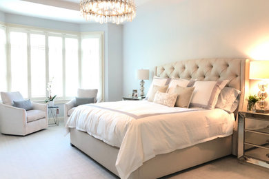 Bedroom - large transitional master carpeted bedroom idea in New York with blue walls
