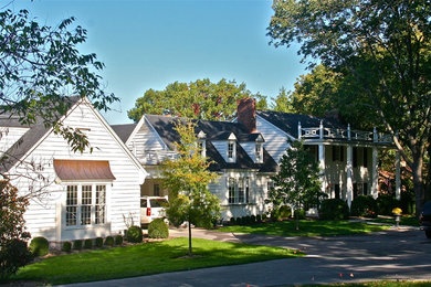 Large elegant white two-story gable roof photo in Nashville