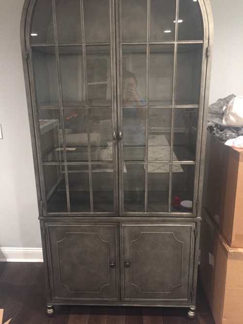 Help anchoring metal hutch to wall?