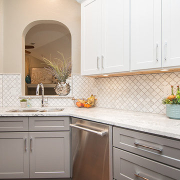 Kitchen | Two-Tone Cabinets | Cambria Quartz | Arabesque Marble Backsplash