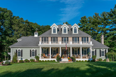 Example of a large multicolored two-story brick exterior home design in Boston with a shingle roof