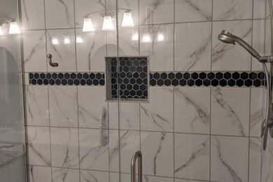 Example of a classic black and white tile and ceramic tile ceramic tile and white floor double shower design in Kansas City