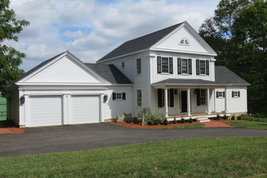 Inspiration for a mid-sized timeless two-story wood exterior home remodel in Boston