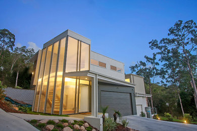 Design ideas for a mid-sized contemporary two-storey beige exterior in Sunshine Coast.