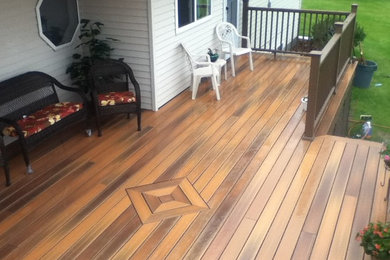 Photo of a large tropical backyard deck in Other with no cover.