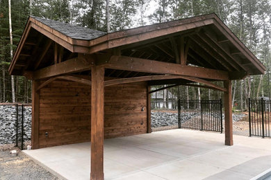 Example of a mid-sized mountain style garage pergola design in Other