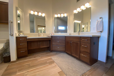 Inspiration for a master double-sink bathroom remodel in Phoenix with dark wood cabinets and a built-in vanity