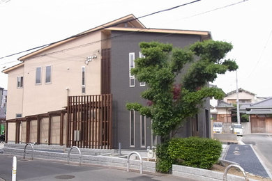 Design ideas for a modern two-storey house exterior in Osaka with a shed roof and a metal roof.