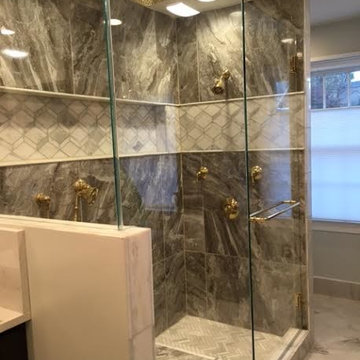 Master Bath w/ custom Mahogany cabinets, large porcelain tiles and marble tiles