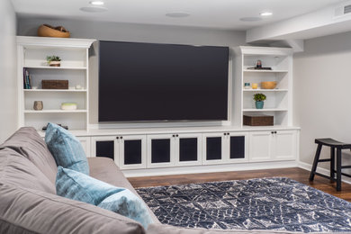 Large transitional look-out laminate floor and brown floor basement photo in Seattle with gray walls