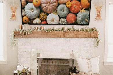 French country vinyl floor and brown floor living room photo in Charlotte with beige walls, a standard fireplace, a stone fireplace and a wall-mounted tv