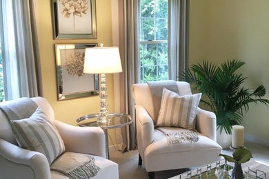 Mid-sized transitional formal and enclosed carpeted living room photo in Cleveland with yellow walls, no fireplace and no tv
