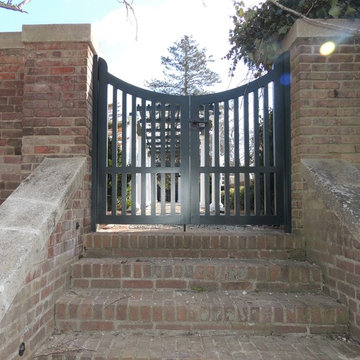 Exterior of Double Gate Hardware entering courtyard with Bronze Latch