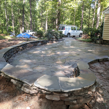 Large Irregular Bluestone Patio, Seating Wall, and Walkways Plus In Laid Design