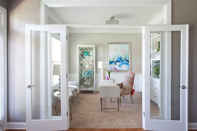 Example of a mid-sized transitional freestanding desk carpeted and beige floor study room design in Atlanta with gray walls