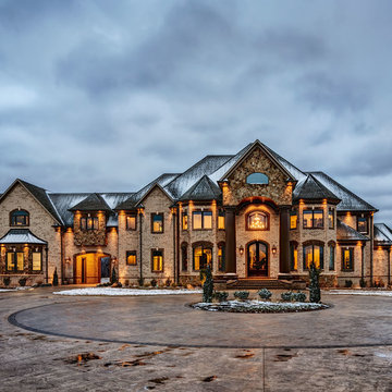 Nottingham Tudor Brick Home featuring Millstone Accents - Tennessee