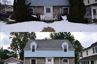 Example of a house exterior design in New York with a shingle roof