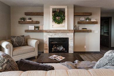 This is an example of a mid-sized transitional open concept living room in Other with grey walls, vinyl floors, a standard fireplace, a tile fireplace surround and grey floor.