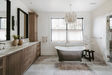 Bathroom - huge transitional master white tile and stone slab porcelain tile, brown floor and double-sink bathroom idea in Denver with medium tone wood cabinets, white walls, an undermount sink, marble countertops, a hinged shower door, a freestanding vanity and flat-panel cabinets