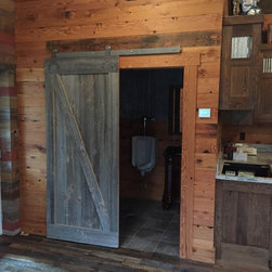 Custom Reclaimed Wood Barn Door on Douglas Fir Paneled Wall - Interior Doors