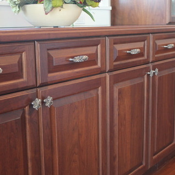 Beautiful Kitchen Featuring the Opulent Scroll Pulls & Opulent Flower Wood Knobs