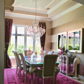 Faux mother of pearl inlay and pearl banding amplify the raspberry carpet.