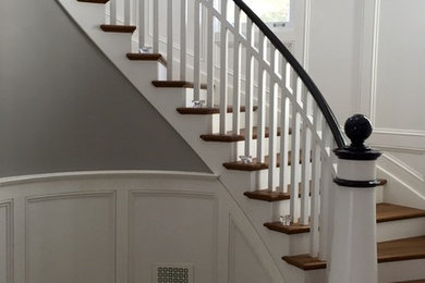 Beach style wooden curved staircase photo in Chicago with wooden risers
