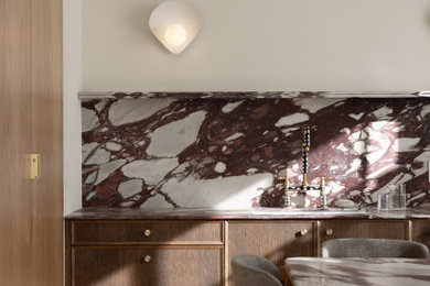 Eat-in kitchen - modern eat-in kitchen idea in San Francisco with marble countertops, marble backsplash and purple countertops