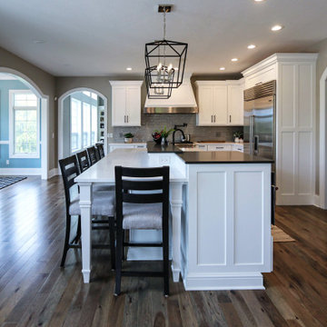 White Transitional Kitchen with Black Hardware and Glass Tile Backsplash