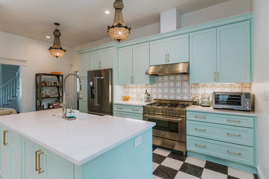 Eat-in kitchen - large contemporary single-wall ceramic tile and black floor eat-in kitchen idea in Austin with a farmhouse sink, shaker cabinets, green cabinets, wood countertops, multicolored backsplash, ceramic backsplash, stainless steel appliances, an island and white countertops