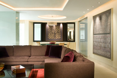 Living room - mid-sized contemporary formal and open concept limestone floor living room idea in Other with beige walls, no fireplace and a concealed tv