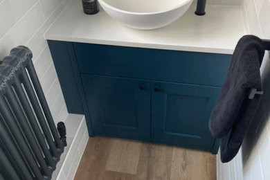 Inspiration for a contemporary cloakroom in Surrey with a built in vanity unit.