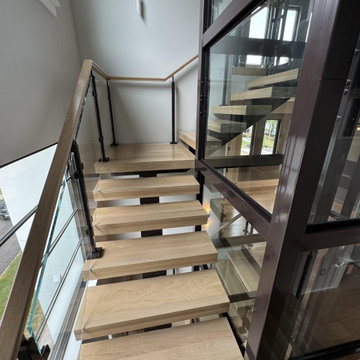 Project #136 | Modern Floating Staircase Encircling Glass Elevator