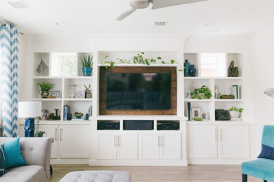 Example of a mid-sized transitional enclosed porcelain tile, brown floor and wallpaper family room design in Phoenix