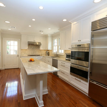 Floor to ceiling cabinetry and a pantry wall maximize the storage in this intima
