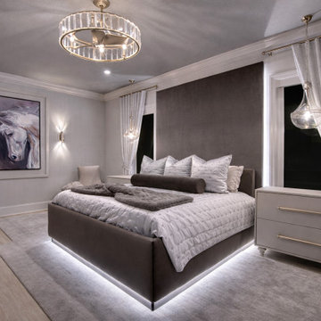 Contemporary Bedroom with Upholstered Bed and Statement Lighting