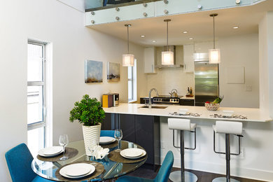 Kitchen/dining room combo - contemporary kitchen/dining room combo idea in Vancouver