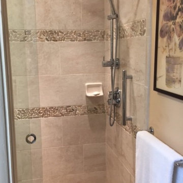 Listello crafted of cut stones is also used for the shower floor