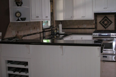 Example of a classic kitchen design in Other