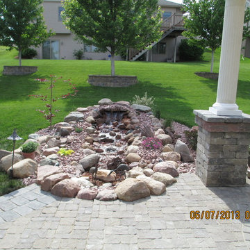 Paver Patio with Fire Place and Pond