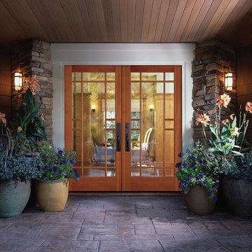 Simpson Entry Doors - Decoratively cut all wood french double with black handles