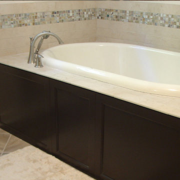 New whirlpool tub with tile surround (adjoins shower at right)
