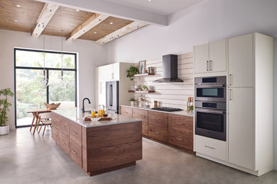 Large beach style eat-in kitchen photo with an island