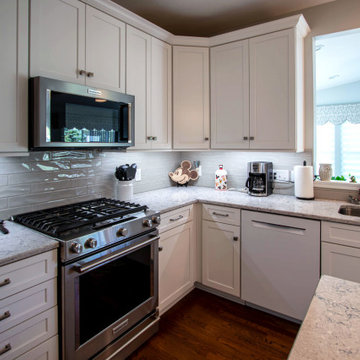 White Shaker Kitchen w/ Pietra Quartz Countertop and Gray Subway Tile Backsplash