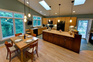 Inspiration for a large timeless single-wall medium tone wood floor kitchen remodel in Baltimore with light wood cabinets, wood countertops and an island
