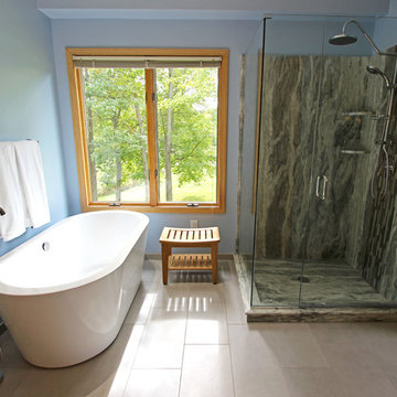 Master Bathroom with Free Standing Tub, Quartz Countertop and Grey Tiled Shower